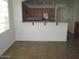Kitchen with a breakfast bar and stainless steel appliances at 43624 W Bailey Dr, Maricopa, AZ 85138