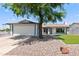 Single story home with a two car garage and landscaped front yard at 6802 E Beverly Ln, Scottsdale, AZ 85254