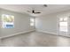 Bedroom with ceiling fan, window, and door leading to the backyard at 6802 E Beverly Ln, Scottsdale, AZ 85254
