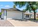 Single story home with a two car garage and landscaped front yard at 6802 E Beverly Ln, Scottsdale, AZ 85254