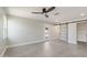 Bedroom with barn door leading to closet and backyard access at 6802 E Beverly Ln, Scottsdale, AZ 85254