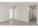 Bright and airy entryway with white door and wood-look tile floors at 6802 E Beverly Ln, Scottsdale, AZ 85254