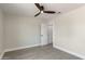 Light and airy bedroom with ceiling fan and access to a hallway at 6802 E Beverly Ln, Scottsdale, AZ 85254