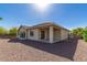 Large backyard with gravel landscaping and covered patio at 13695 N 148Th Dr, Surprise, AZ 85379