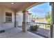 Covered porch with arched entryway offering a view of the street at 18465 N Falcon Ln, Maricopa, AZ 85138