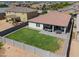 Aerial view of house, backyard, and grassy area at 18465 N Falcon Ln, Maricopa, AZ 85138