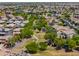 Aerial view of community park with walking paths and trees at 18465 N Falcon Ln, Maricopa, AZ 85138