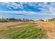 Empty lot with grass and distant buildings at 1112 N Center St, Mesa, AZ 85201