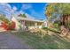 Ranch style home with covered porch and green lawn at 1112 N Center St, Mesa, AZ 85201