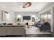 Spacious living room with gray sofas and a large TV at 26496 W Lone Cactus Dr, Buckeye, AZ 85396