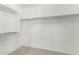 Walk-in closet with ample shelving and hanging space at 26496 W Lone Cactus Dr, Buckeye, AZ 85396