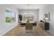 Bright dining room features a chandelier and large windows at 26496 W Lone Cactus Dr, Buckeye, AZ 85396