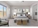 Spacious bedroom with a king-size bed and ample natural light at 26496 W Lone Cactus Dr, Buckeye, AZ 85396