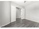 Bedroom with hardwood floors and double doors at 26496 W Lone Cactus Dr, Buckeye, AZ 85396