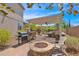 Relaxing backyard patio with pergola, built-in grill, and fire pit at 9231 W Bent Tree Dr, Peoria, AZ 85383