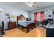 Comfortable bedroom with wooden furniture and plenty of natural light at 43502 W Kramer Ln, Maricopa, AZ 85138