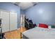 Spacious bedroom with wood floors and double doors at 43502 W Kramer Ln, Maricopa, AZ 85138