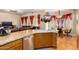 Spacious kitchen with island, stainless steel appliances, and ample counter space at 43502 W Kramer Ln, Maricopa, AZ 85138