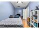 Bright bedroom with wood floors and a ceiling fan at 43502 W Kramer Ln, Maricopa, AZ 85138