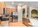 Well-equipped kitchen, featuring stainless steel appliances and wood cabinets at 43502 W Kramer Ln, Maricopa, AZ 85138