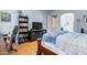 Charming bedroom with hardwood floors and built-in shelving at 43502 W Kramer Ln, Maricopa, AZ 85138