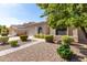 One-story home with a landscaped yard and walkway at 43502 W Kramer Ln, Maricopa, AZ 85138