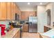 Modern kitchen with stainless steel refrigerator and ample cabinetry at 43502 W Kramer Ln, Maricopa, AZ 85138
