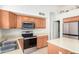 Bright kitchen with stainless steel appliances and wood cabinets at 2420 W Blue Sky Dr, Phoenix, AZ 85085
