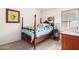Charming bedroom with a wooden four-poster bed at 2420 W Blue Sky Dr, Phoenix, AZ 85085