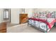 Well-lit bedroom showcasing a metal bed frame and wood dresser at 2420 W Blue Sky Dr, Phoenix, AZ 85085