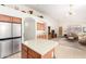 Modern kitchen with stainless steel appliances and an island with seating at 2420 W Blue Sky Dr, Phoenix, AZ 85085