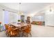 Dining area with a large table and chairs, situated near the living room at 2420 W Blue Sky Dr, Phoenix, AZ 85085