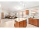 Open kitchen with a large island, ample counter space, and a view of the living area at 2420 W Blue Sky Dr, Phoenix, AZ 85085