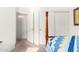 Bedroom with a wooden bed and access to hallway at 2420 W Blue Sky Dr, Phoenix, AZ 85085