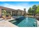 Spacious backyard with a large pool, spa, and comfortable seating at 6032 W Victoria Pl, Chandler, AZ 85226