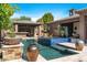 Relaxing backyard with a beautiful pool, spa, and covered patio at 6032 W Victoria Pl, Chandler, AZ 85226