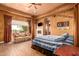 Main bedroom with a four-poster bed and sitting area at 8157 E Sierra Morena St, Mesa, AZ 85207