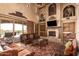 Living area with fireplace, access to patio, and rich decor at 8157 E Sierra Morena St, Mesa, AZ 85207