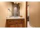 Vanity with wood cabinets and a granite countertop at 8157 E Sierra Morena St, Mesa, AZ 85207