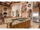 Large kitchen island with granite countertops and stainless steel appliances at 8157 E Sierra Morena St, Mesa, AZ 85207