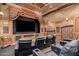 Home theater with black leather seating and large screen at 8157 E Sierra Morena St, Mesa, AZ 85207