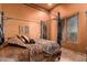 Guest bedroom with a four-poster bed and large window at 8157 E Sierra Morena St, Mesa, AZ 85207