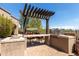 Outdoor kitchen with pergola and built-in grill at 8157 E Sierra Morena St, Mesa, AZ 85207