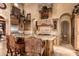 Island kitchen with granite countertops and custom cabinetry at 8157 E Sierra Morena St, Mesa, AZ 85207