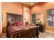 Spacious bedroom with a large bed, dresser, and plenty of natural light at 8157 E Sierra Morena St, Mesa, AZ 85207