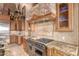 Gourmet kitchen with granite counters, stainless steel appliances, and custom cabinetry at 8157 E Sierra Morena St, Mesa, AZ 85207