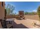 Relaxing patio featuring a stone fireplace and seating at 8157 E Sierra Morena St, Mesa, AZ 85207