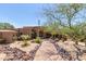 Beautiful desert landscape surrounds this luxury home with a welcoming entryway at 8157 E Sierra Morena St, Mesa, AZ 85207