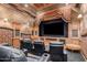 Home theater with black leather seating and large screen at 8157 E Sierra Morena St, Mesa, AZ 85207