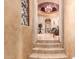 Elegant staircase leading to another level with arched entryways at 8157 E Sierra Morena St, Mesa, AZ 85207